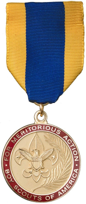 A medal hanging from a blue and yellow ribbon