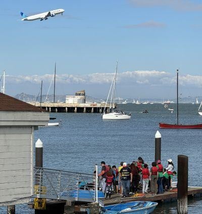 Scouts on the dock at the Sea Scout base watching the fleet week airshow