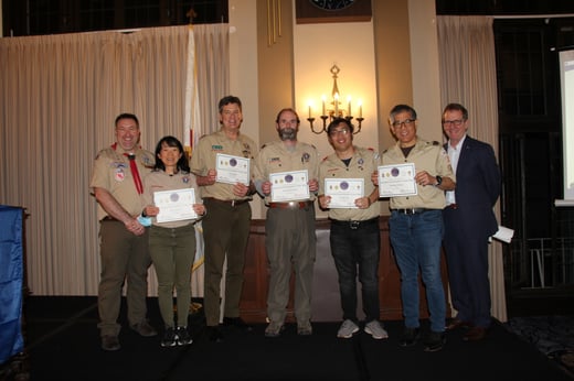 group picture on stage at district volunteer recognition dinner