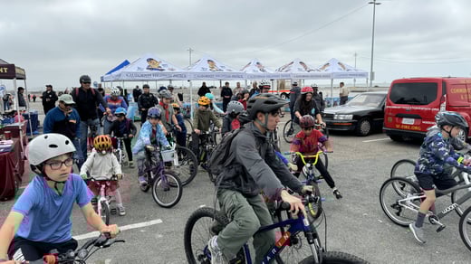 scouts riding bikes at bike rodeo